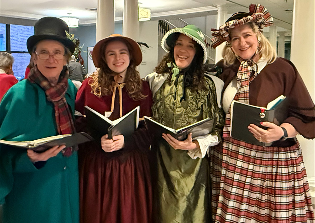 Rydia with
                              fellow Christmas Carolers